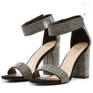 Jeweled ankle strap heeled sandal.